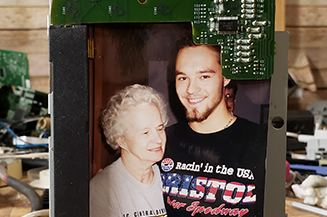 Close up of picture frame created from fax machine partss.