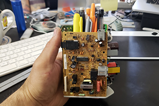 Motherboard of a fax machine made into a 3D triangle shape.