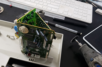 Fax machine parts scrapped to create pen holder.