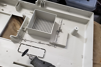 Fax machine part with dimensions for front end loader cut out.