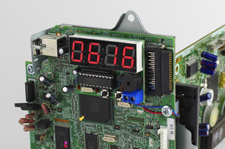 Close up of clock from old fax machine.