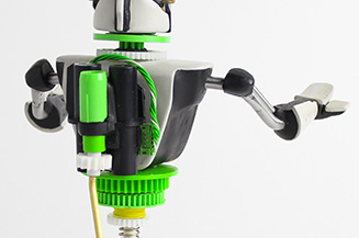 Close up on middle of robot made from fax parts.