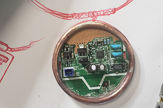Layout of jewelry scultpure made rom fax machine.
