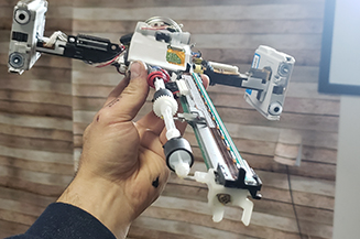 Fax machine parts designed into wing shape.